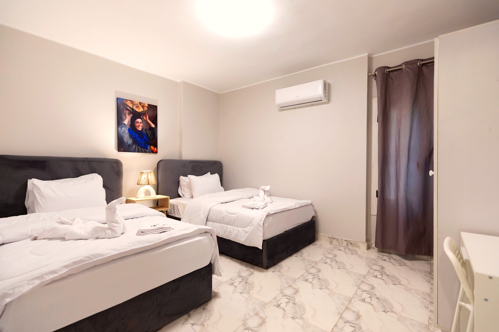 Twin bedroom with soft blue accents